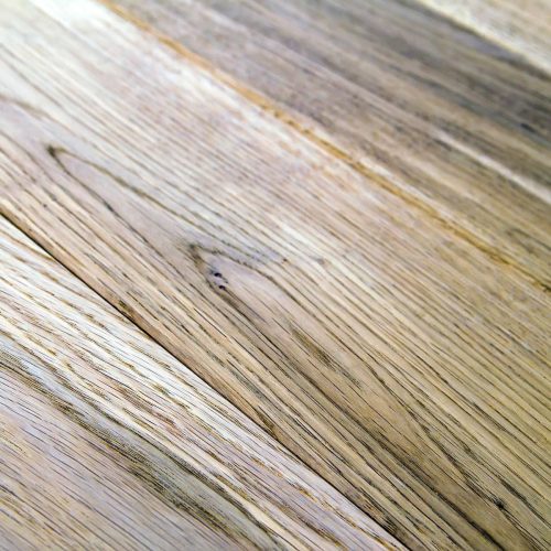Several planks of beautiful laminate or parquet flooring with wooden texture as background